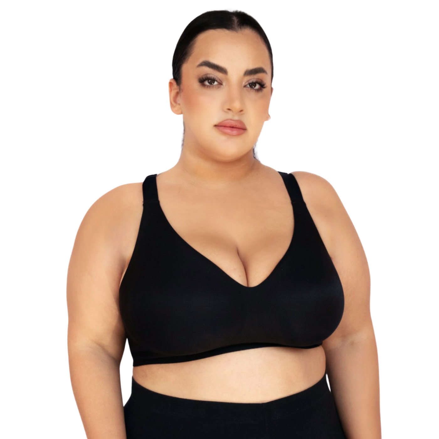 Woman wearing a black sports bra on a white background