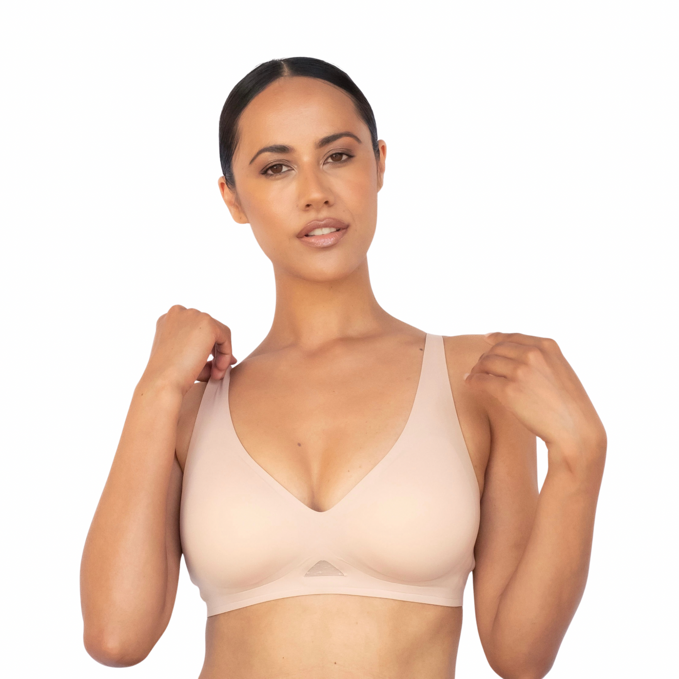 Woman wearing a beige bra on a white background